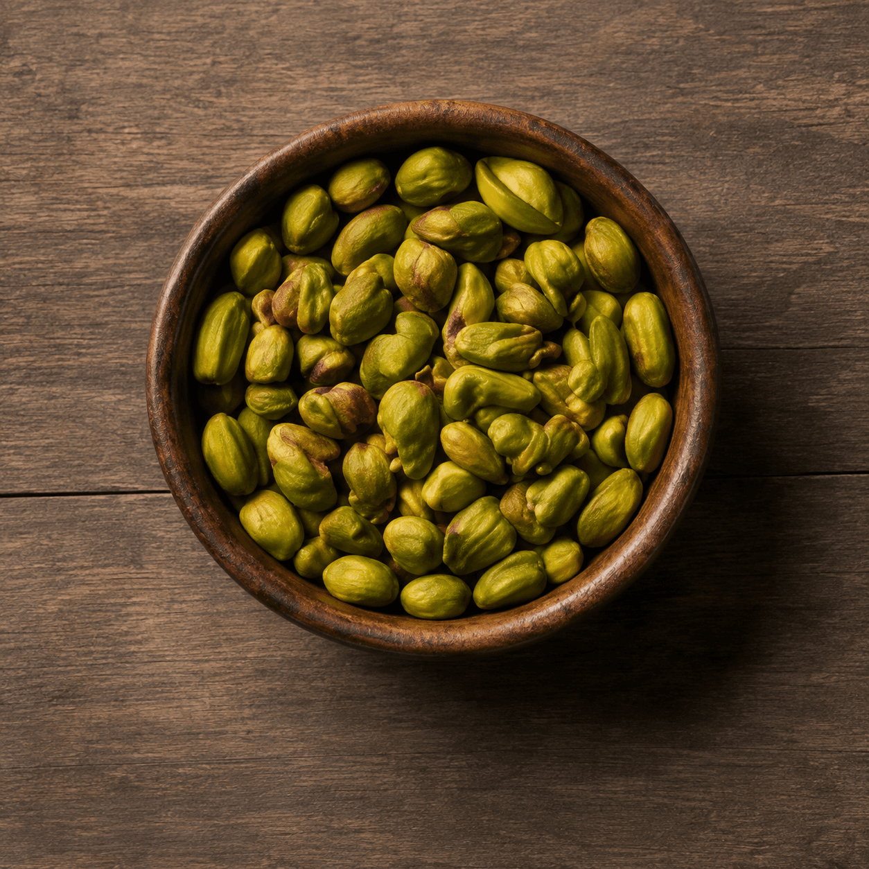 100% kernel grade pistachios, whole kernels shown loose.